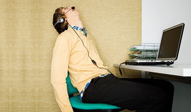 Office worker sleeping in chair